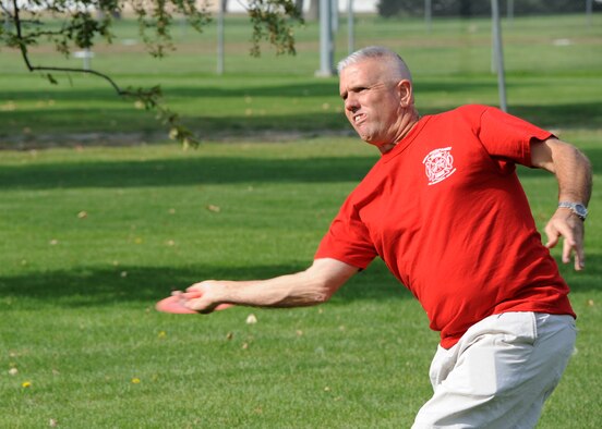 Tech. Sgt. Larry C. Kirk, 144th Maintenance Squadron aerospace ground equipment technician, tees off playing the nine-hole disc golf course at Miller Park on Fairchild Air Force Base, Wash., Oct. 1, 2012. Disc golf was known as Frisbee golf in its early years and has evolved over the last 35 years. It is played much like traditional golf however instead of using a ball and club, players use flying a disc. (U.S. Air Force photo/Staff Sgt. Michael Means) 

