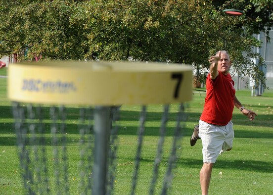 Tech. Sgt. Larry C. Kirk, 144th Maintenance Squadron aerospace ground equipment technician, throws for a birdie at the nine-hole disc golf course at Miller Park on Fairchild Air Force Base, Wash., Oct. 1, 2012. Kirk is with the California Air National Guard in Fresno, Calif. (U.S. Air Force photo/Staff Sgt. Michael Means) 

