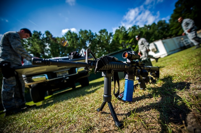 An M4 carbine filled with simunition, non-lethal training ammunition, waits between uses during an active shooter scenario Sept. 26, 2012, at Joint Base Charleston - Weapons Station, S.C.  During the scenario, Airmen practiced entering a house under control of hostile forces and eliminated the threat while identifying and controlling non-hostile inhabitants. Security Forces Airmen test their skills and knowledge in simulated hostile environments to prepare for real-world events. (U.S. Air Force photo/Airman 1st Class George Goslin)