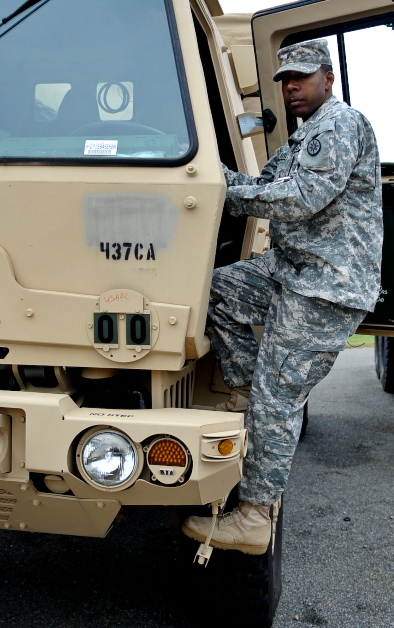 Sgt. Hilton Hunter, motor transportation operator with the Warrior Transition Unit, climbs on board a Light Multi-Purpose Vehicle cargo troop carrier at the 99th Regional Readiness Command Equipment Concentration Site Motor Pool, Fort Eustis, Va. Hunter joined the Army in 2003, was injured in Afghanistan in 2011, and is now preparing to head back into the civilian workforce as a small-business owner. (U.S. Air Force photo by Staff Sgt. Wesley Farnsworth/Released)