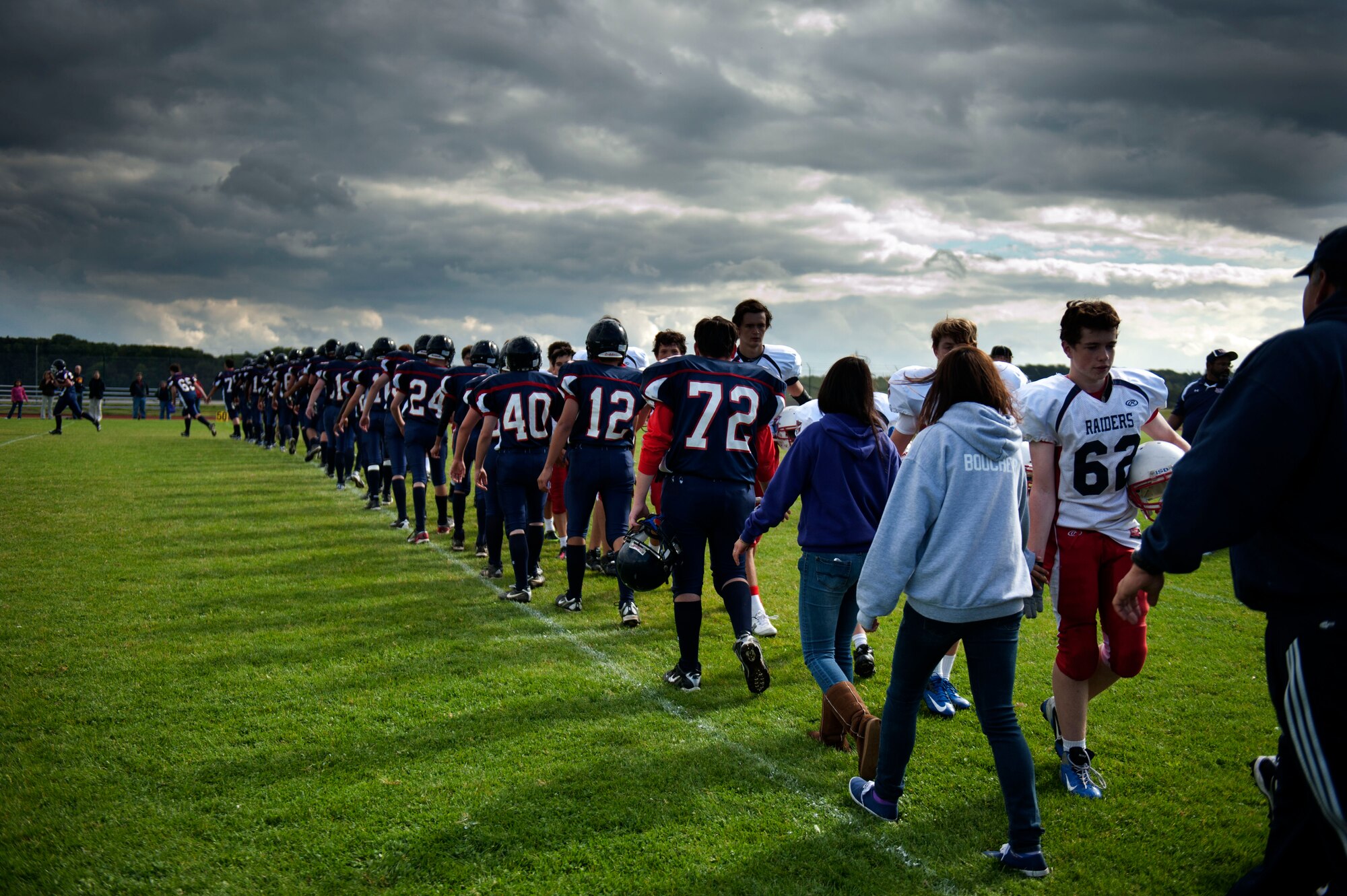 BITBURG ANNEX, Germany –Barons players shake hands with their opponents after their homecoming game against the Raiders at Bitburg High School Sept. 29.  The Barons have won the last three Department of Defense European Division II championships and are undefeated this year. (U.S. Air Force photo by Airman 1st Class Gustavo Castillo/Released)