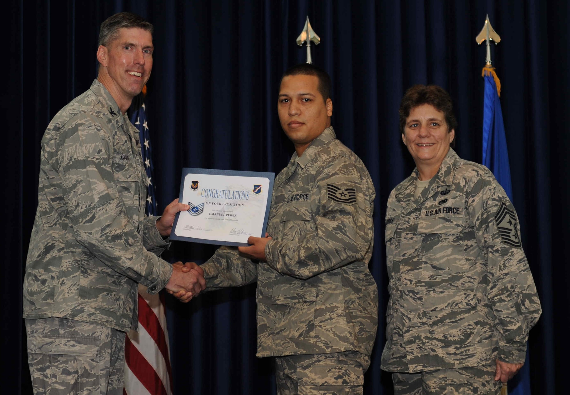 Emanuel Perez, 728th Air Mobility Squadron, is promoted to the rank of  technical sergeant Sept. 28, 2012, at the club complex ballroom at Incirlik Air Base, Turkey. (U.S. Air Force photo by Senior Airman Anthony  Sanchelli/Released)