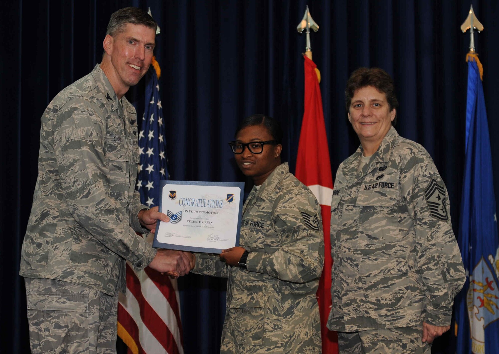 Regina Green, 39th Logistics Readiness Squadron, is promoted to the rank of  technical sergeant Sept. 28, 2012, at the club complex ballroom at Incirlik Air Base, Turkey. (U.S. Air Force photo by Senior Airman Anthony  Sanchelli/Released)