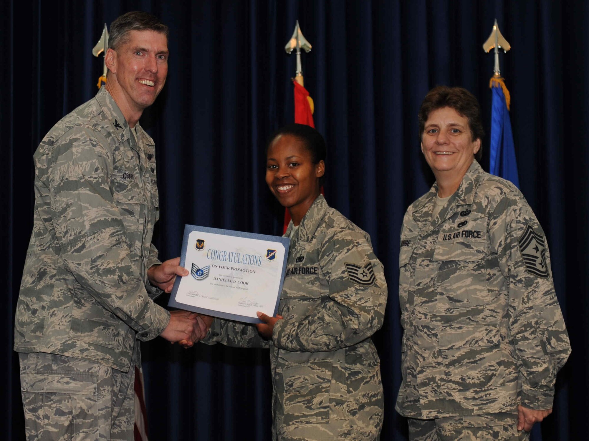 Danielle Cook, 39th Logistics Readiness Squadron, is promoted to the rank of  technical sergeant Sept. 28, 2012, at the club complex ballroom at Incirlik Air Base, Turkey. (U.S. Air Force photo by Senior Airman Anthony  Sanchelli/Released)