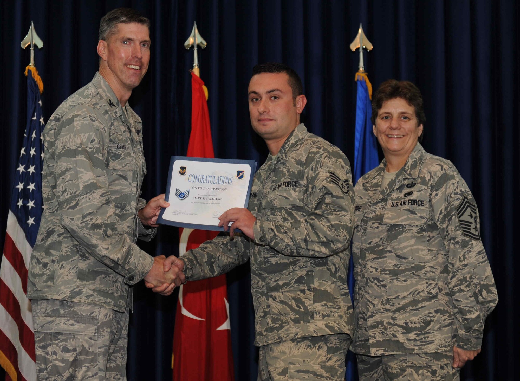 Mark Catalano, 728th Air Mobility Squadron, is promoted to the rank of  staff sergeant Sept. 28, 2012, at the club complex ballroom at Incirlik Air Base, Turkey. (U.S. Air Force photo by Senior Airman Anthony  Sanchelli/Released)