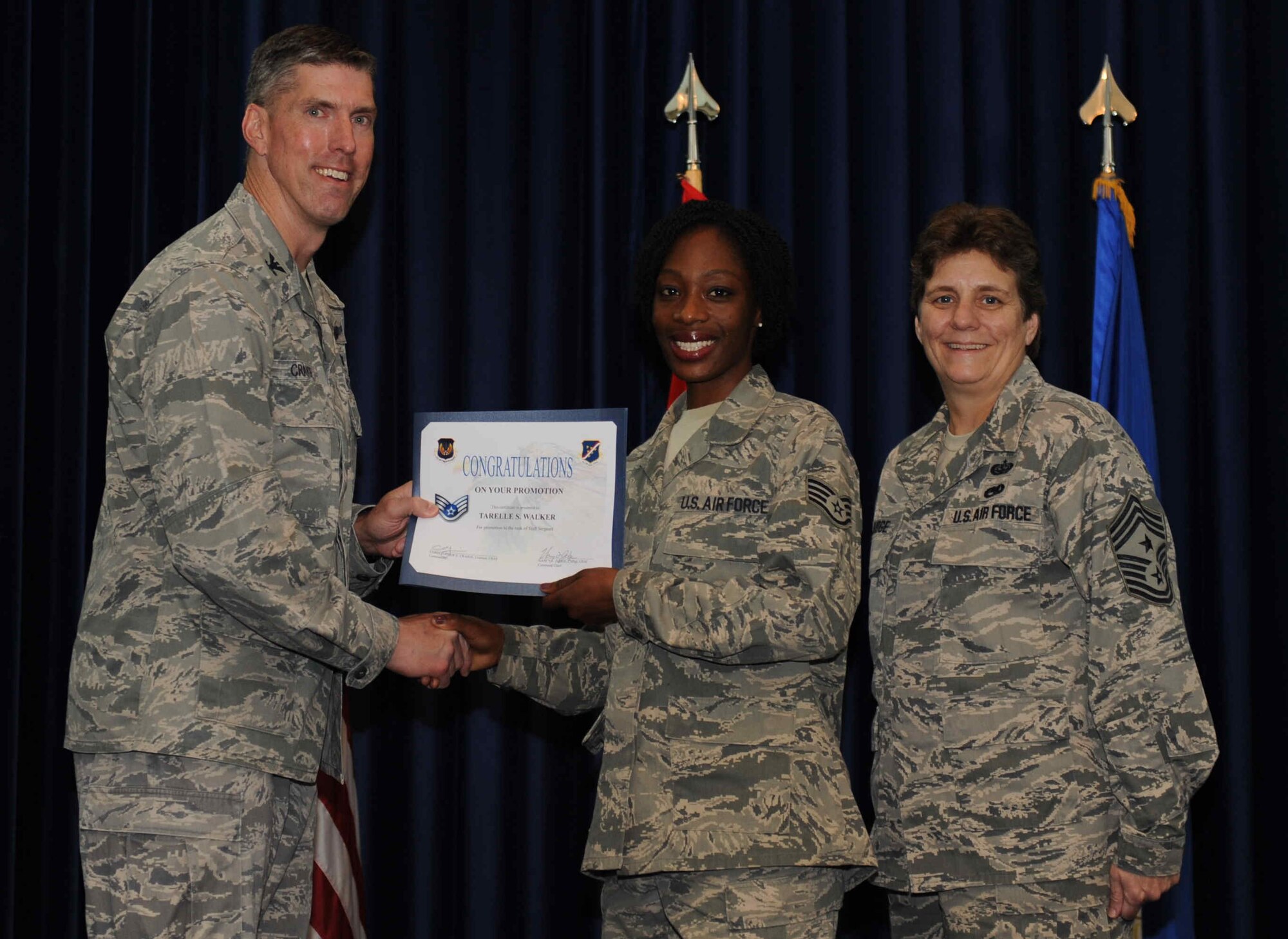 Tarelle Walker, American Forces Network Incirlik, is promoted to the rank of  staff sergeant Sept. 28, 2012, at the club complex ballroom at Incirlik Air Base, Turkey. (U.S. Air Force photo by Senior Airman Anthony  Sanchelli/Released)