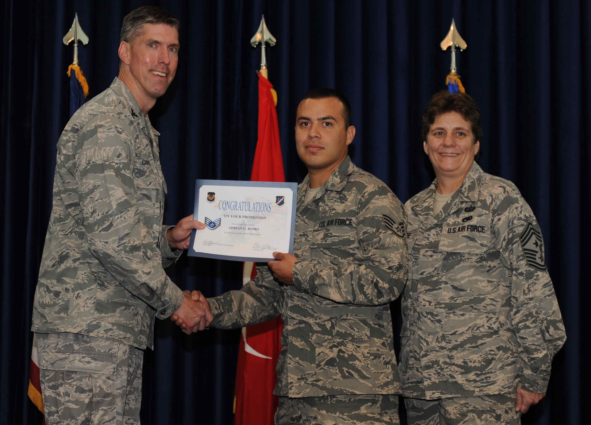 Adrian Romo, 728th Air Mobility Squadron, is promoted to the rank of  staff sergeant Sept. 28, 2012, at the club complex ballroom at Incirlik Air Base, Turkey. (U.S. Air Force photo by Senior Airman Anthony  Sanchelli/Released)