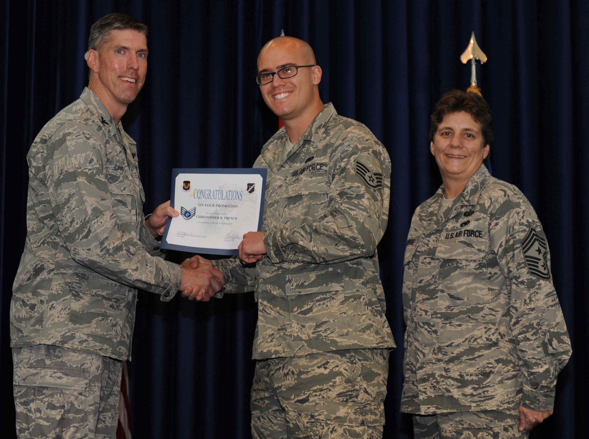 Christopher French, 728th Air Mobility Squadron, is promoted to the rank of  staff sergeant Sept. 28, 2012, at the club complex ballroom at Incirlik Air Base, Turkey. (U.S. Air Force photo by Senior Airman Anthony  Sanchelli/Released)
