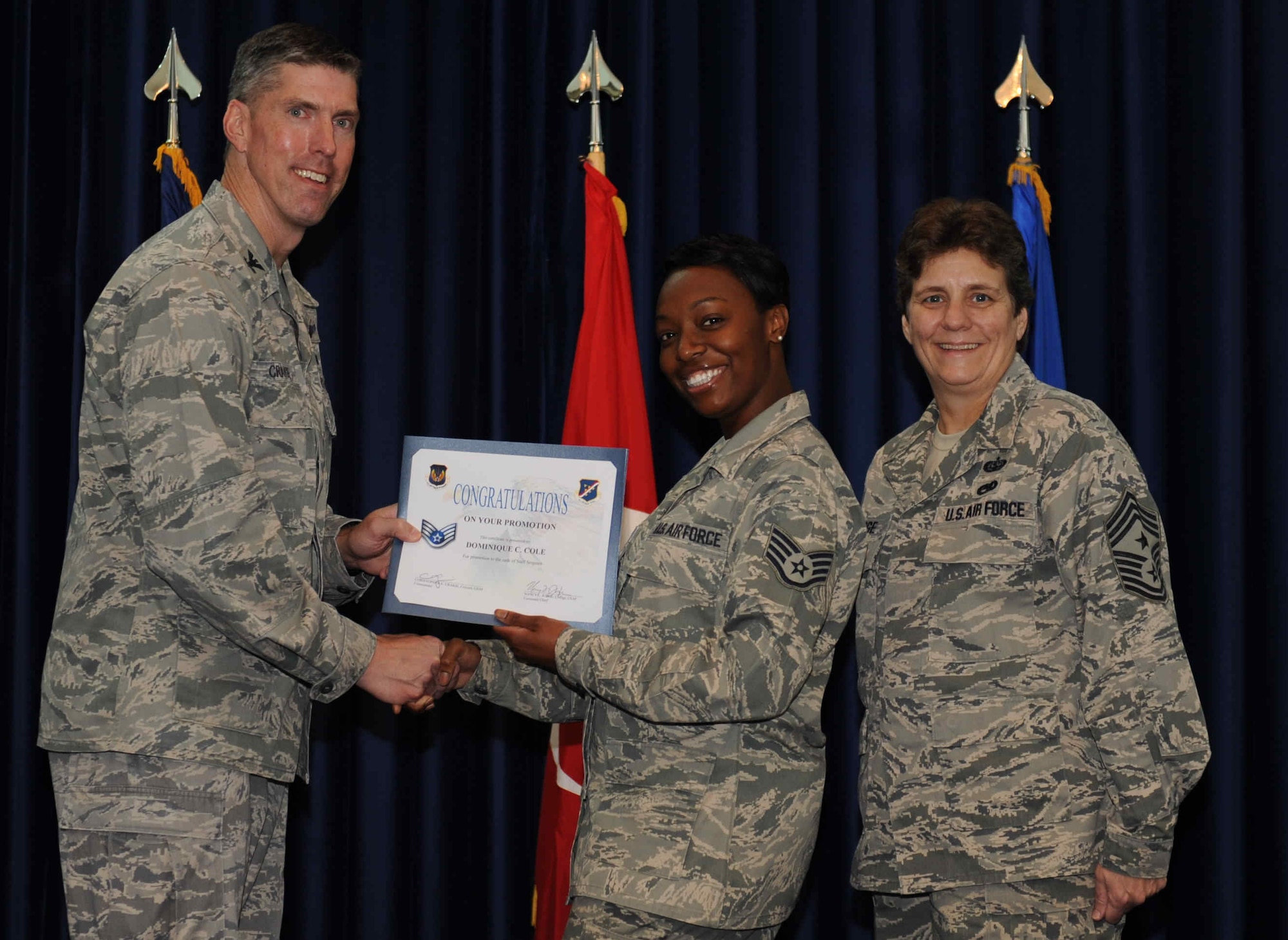 Dominique Cole, 39th Medical Operations Squadron, is promoted to the rank of  staff sergeant Sept. 28, 2012, at the club complex ballroom at Incirlik Air Base, Turkey. (U.S. Air Force photo by Senior Airman Anthony  Sanchelli/Released)