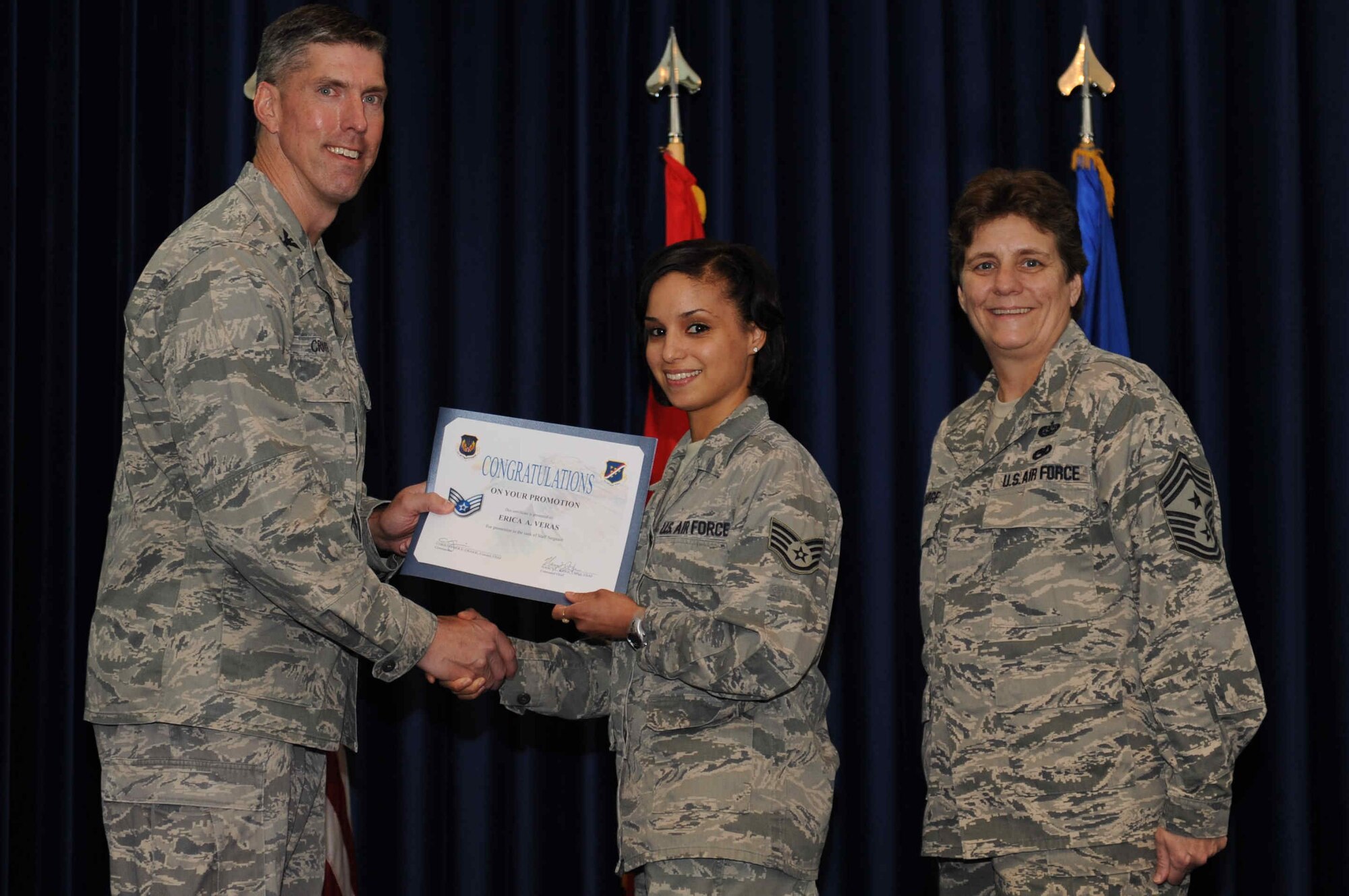 Erica Veras, 39th Force Support Squadron, is promoted to the rank of  staff sergeant Sept. 28, 2012, at the club complex ballroom at Incirlik Air Base, Turkey. (U.S. Air Force photo by Senior Airman Anthony  Sanchelli/Released)