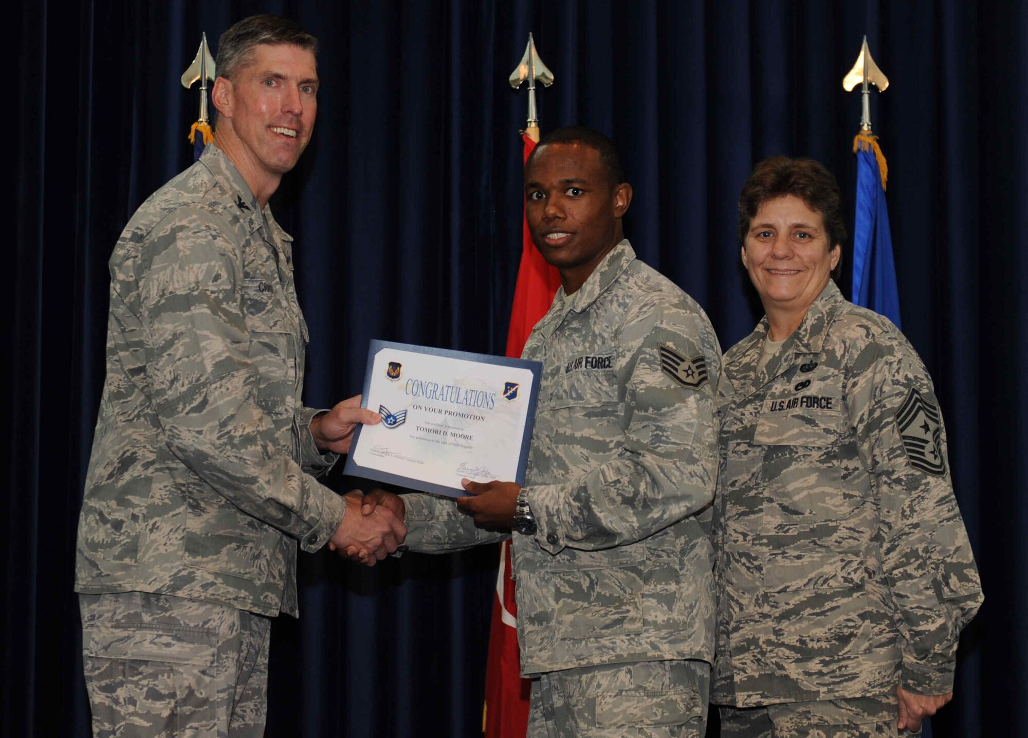 Tomori Moore, 39th Logistics Readiness Squadron, is promoted to the rank of  staff sergeant Sept. 28, 2012, at the club complex ballroom at Incirlik Air Base, Turkey. (U.S. Air Force photo by Senior Airman Anthony  Sanchelli/Released)