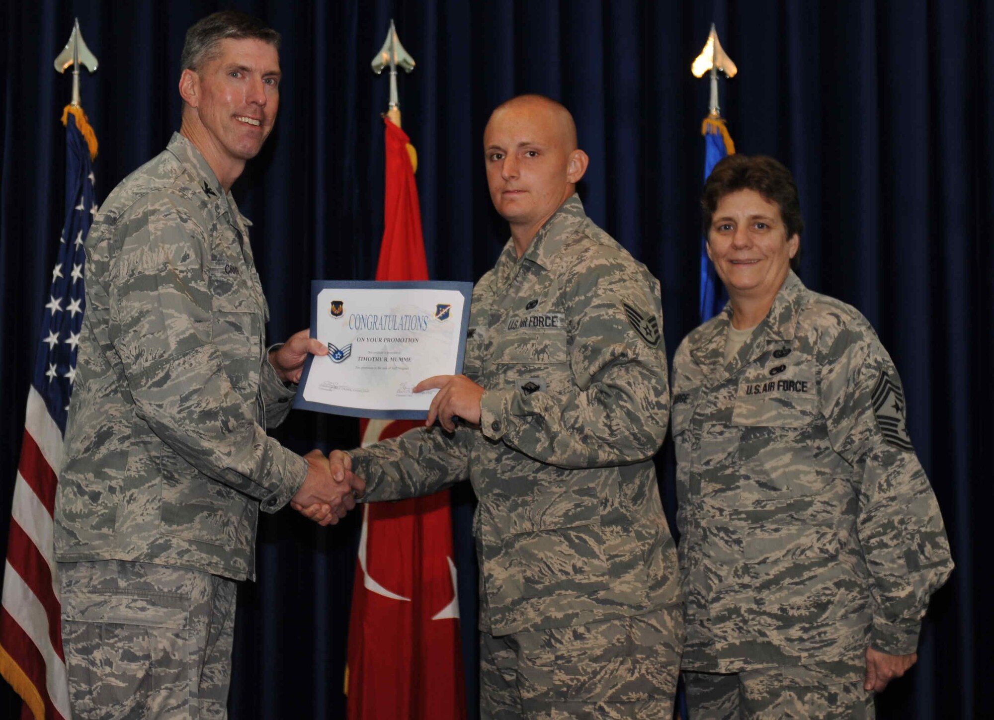 Timothy Mumme, 39th Security Forces Squadron, is promoted to the rank of  staff sergeant Sept. 28, 2012, at the club complex ballroom at Incirlik Air Base, Turkey. (U.S. Air Force photo by Senior Airman Anthony  Sanchelli/Released)