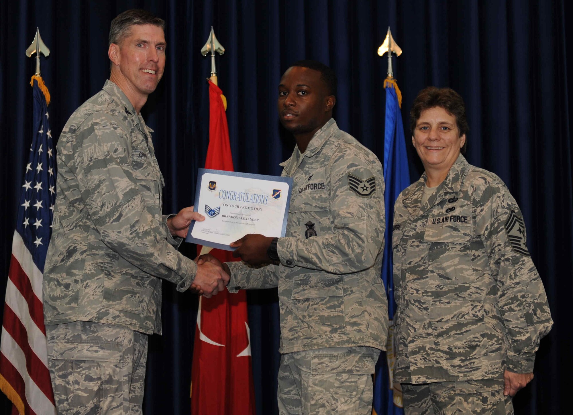 Brandon Miller, 39th Security Forces Squadron, is promoted to the rank of  staff sergeant Sept. 28, 2012, at the club complex ballroom at Incirlik Air Base, Turkey. (U.S. Air Force photo by Senior Airman Anthony  Sanchelli/Released)