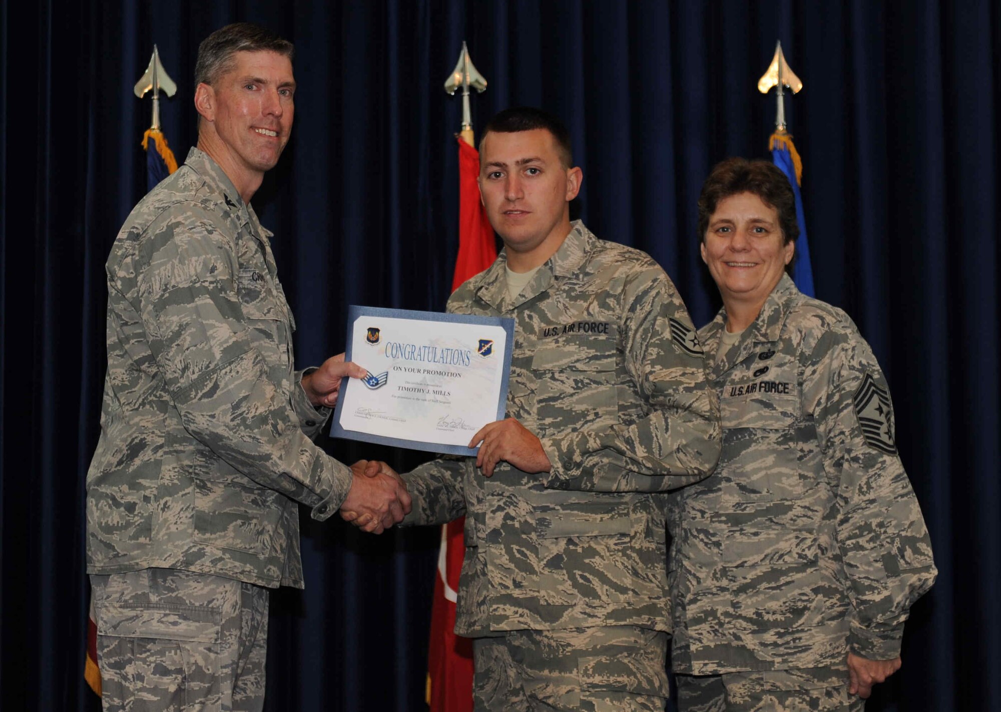 Timothy Mills, 39th Maintenance Squadron, is promoted to the rank of  senior airman Sept. 28, 2012, at the club complex ballroom at Incirlik Air Base, Turkey. (U.S. Air Force photo by Senior Airman Anthony  Sanchelli/Released)