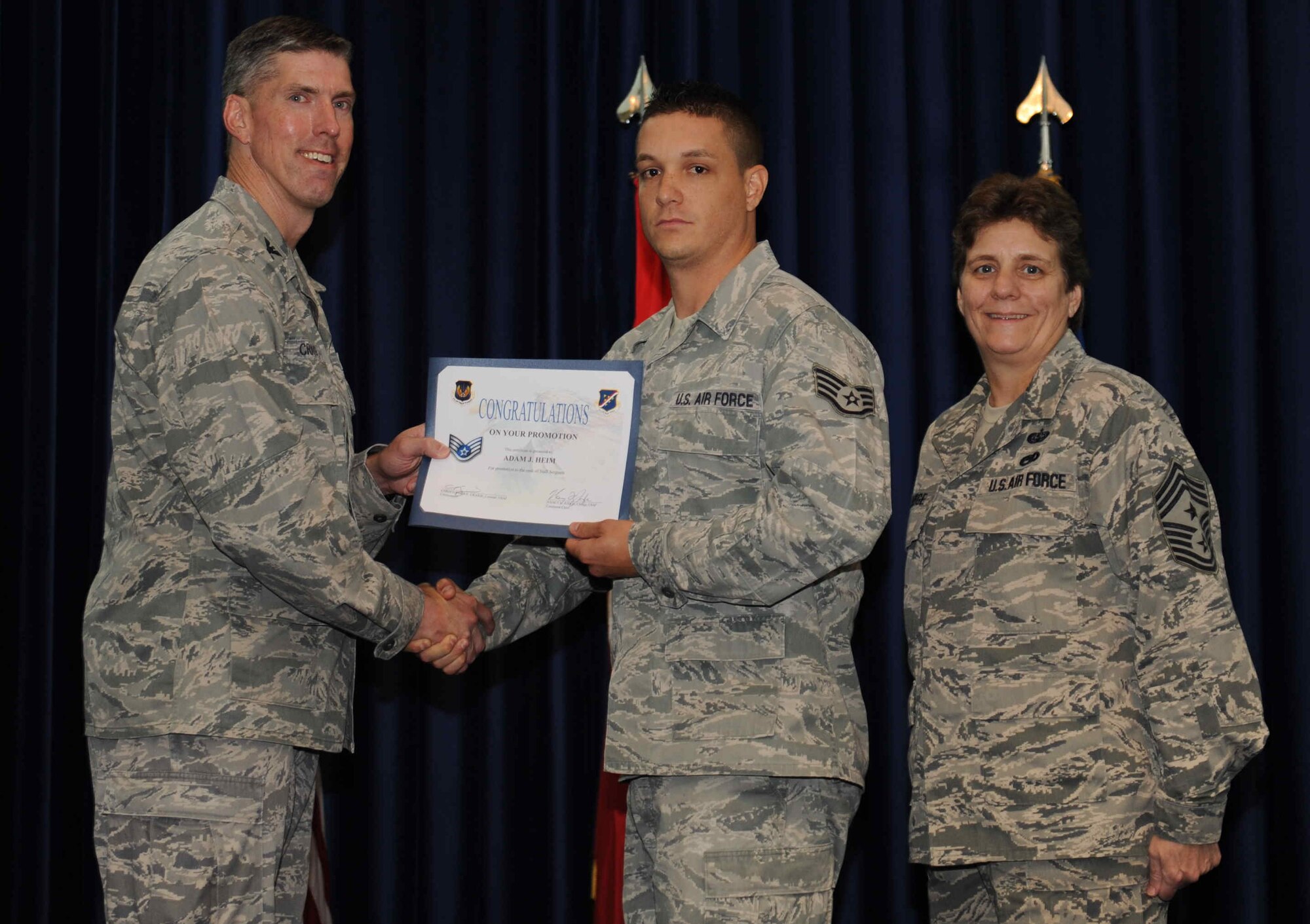 Adam Heim, 39th Maintenance Squadron, is promoted to the rank of  senior airman Sept. 28, 2012, at the club complex ballroom at Incirlik Air Base, Turkey. (U.S. Air Force photo by Senior Airman Anthony  Sanchelli/Released)