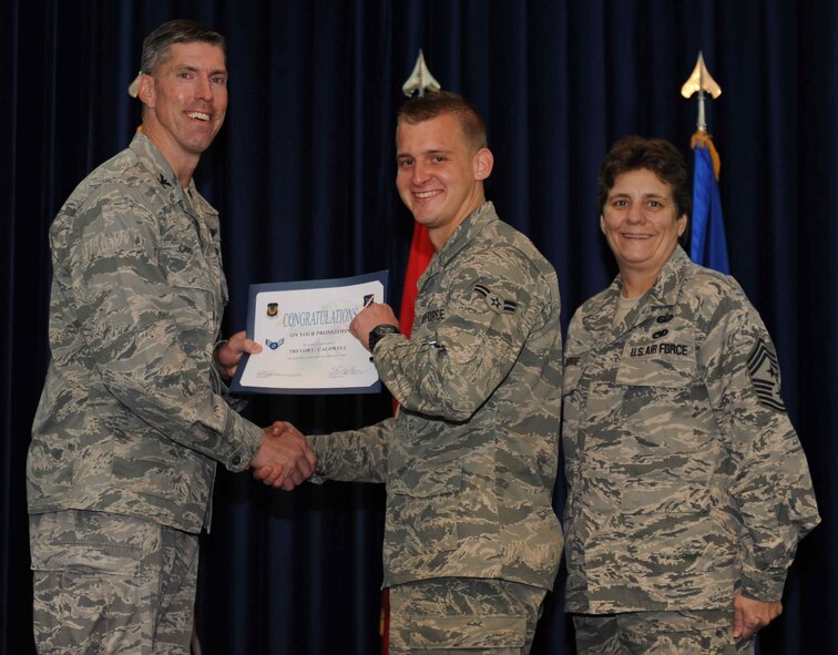 Trevor Caldwell, 728th Air Mobility Squadron, is promoted to the rank of  airman first class Sept. 28, 2012, at the club complex ballroom at Incirlik Air Base, Turkey. (U.S. Air Force photo by Senior Airman Anthony  Sanchelli/Released)