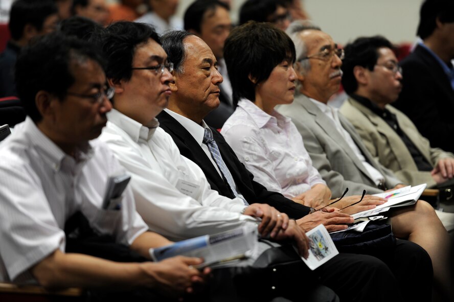 Reporters from Japanese media organizations listen to an 18th Wing mission briefing at the Erwin Professional Military Education Center on Kadena Air Base, Japan, during a visit to the base Sept. 28, 2012. One hundred sixty Japanese reporters attending the 56th annual National Council to Promote Ethics of Mass Media conference visited Kadena to learn about the 18th Wing's strategic importance and mission. The journalists were briefed on Kadena's mission by U.S. Air Force Brig. Gen. Matt Molloy, 18th Wing commander, before viewing a static display of a U.S. Air Force HH-60 Pave Hawk helicopter and an F-15 Eagle fighter aircraft. (U.S. Air Force photo/ Senior Airman Maeson L. Elleman)