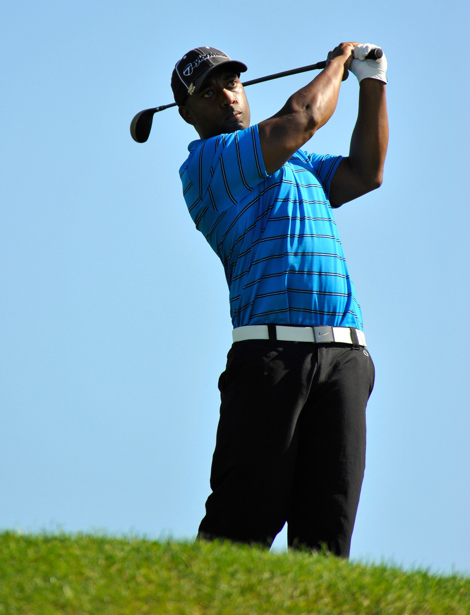 Joseph Finney, 373rd Support Squadron golf team member, watches his ball after teeing off during the intramural golf championship at Misawa Air Base, Japan, Oct. 1, 2012. The championship featured the 373 SPTS and the 35th Maintenance Squadron. The 35 MXS defeated the 373 SPTS in a sudden-death playoff after both teams finished even through 18 holes. (U.S. Air Force photo by Airman 1st Class Zachary Kee)