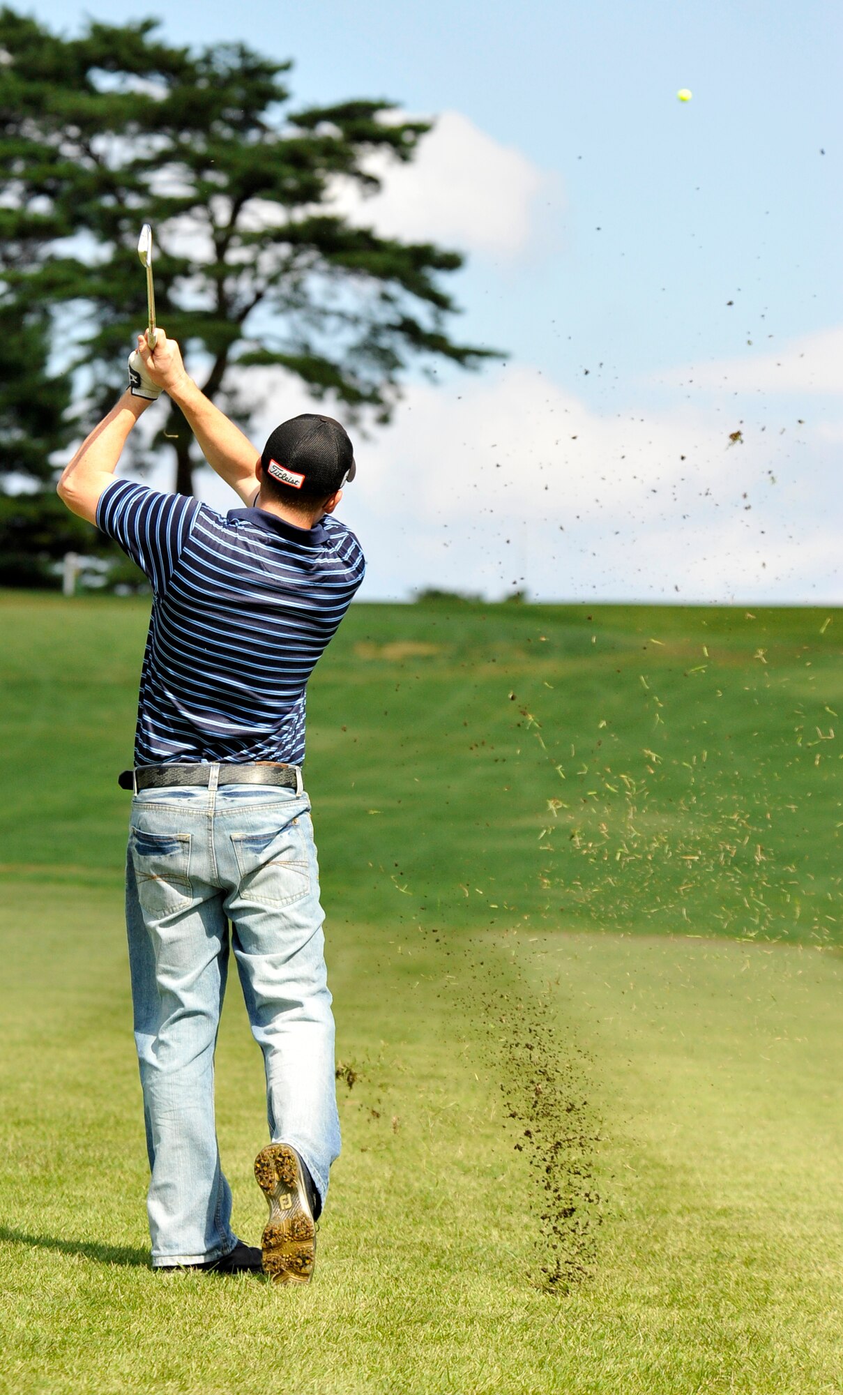 Brandon Colby, 35th Maintenance Squadron golf team member, watches his ball head toward the pin during the intramural golf championship at Misawa Air Base, Japan, Oct. 1, 2012. The 35 MXS defeated 373rd Support Squadron in a sudden-death playoff after both teams went even through 18 holes. (U.S. Air Force photo by Airman 1st Class Zachary Kee)