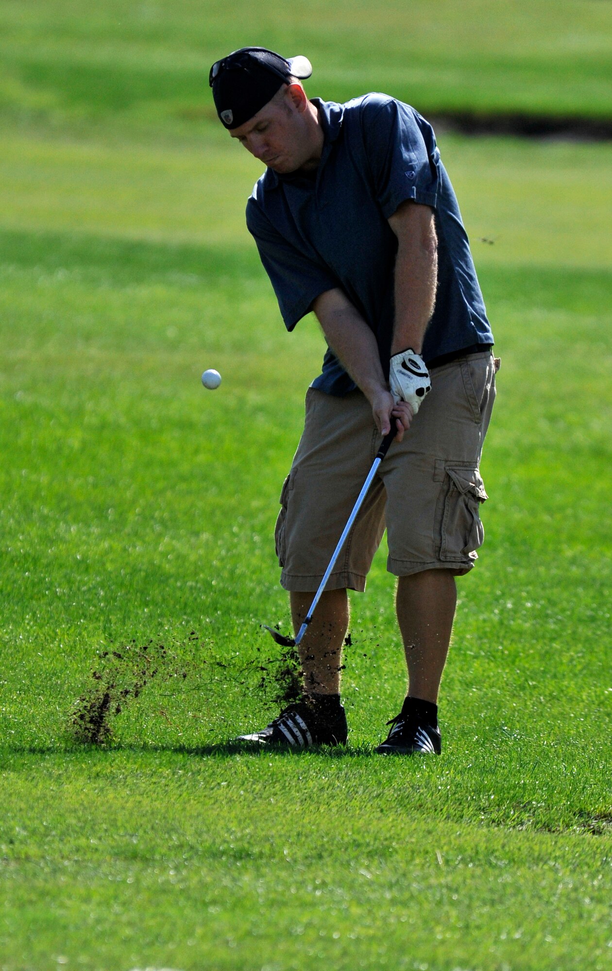 Adam Larson, 373rd Support Squadron golf team member, goes for the green from the fairway during the intramural golf championship at Misawa Air Base, Japan, Oct. 1, 2012. The 373 SPTS fell to the 35th Maintenance Squadron in match play by one hole. In match play, either one team wins, loses or splits a hole. At the end of the day both teams were even through 18 holes, but the 35 MXS came out on top of the 373 SPTS in the first sudden-death playoff hole, giving them the championship. (U.S. Air Force photo by Airman 1st Class Zachary Kee)