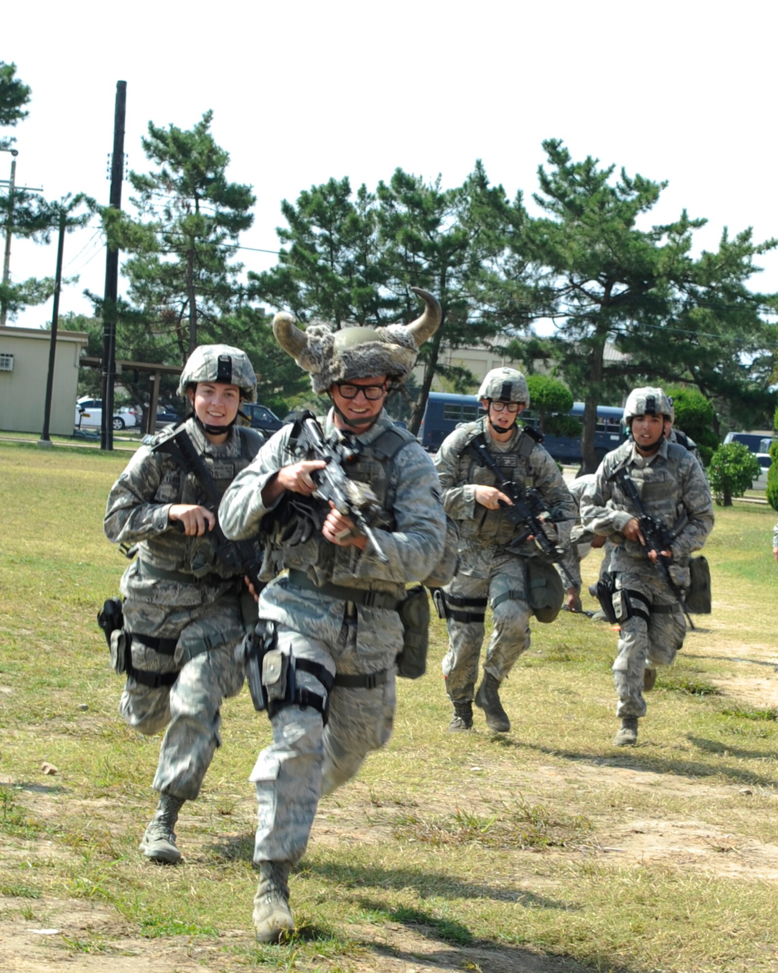 The 8th Security Forces Squadron Bravo flight sprints as a team during the Defenders Challenge Sept. 28, 2012, at Kunsan Air Base, Republic of Korea. The challenge was held after a month of training during which Airmen newer to the squadron learned combat skills and knowledge from SFS members with previous deployment experience.  (U.S. Air Force photo/Senior Airman Brigitte N. Brantley)