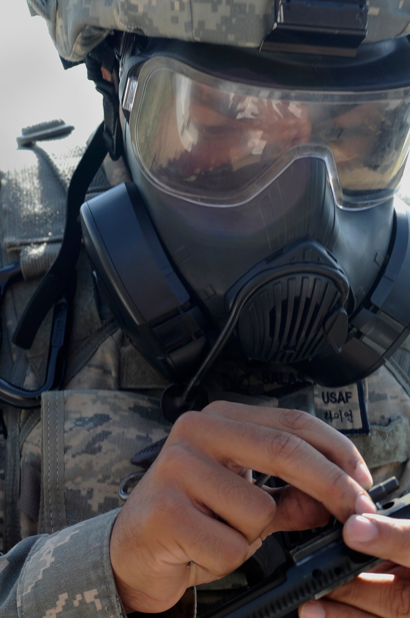 Airman 1st Class Ryan Salas, 8th Security Forces Squadron Bravo flight, assembles the bolt carrier for an M4 carbine during the Defenders Challenge Sept. 28, 2012, at Kunsan Air Base, Republic of Korea. The SFS members spent weeks training on individual and team tactics before the flights demonstrated who was the most tactically proficient. (U.S. Air Force photo/Senior Airman Brigitte N. Brantley)