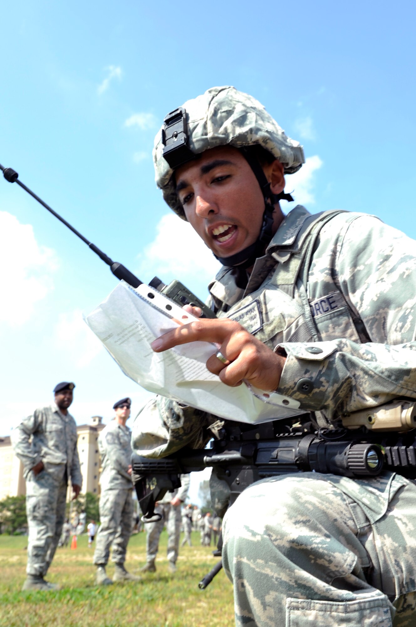 Airman 1st Class Ryan Salas, 8th Security Forces Squadron Bravo flight, tests a newly-programmed radio during the first event of the Defenders Challenge held Sept. 28, 2012, at Kunsan Air Base, Republic of Korea. Teams were timed on their ability to complete an obstacle course as they highlighted combat skills learned during recent training. (U.S. Air Force photo/Senior Airman Brigitte N. Brantley)