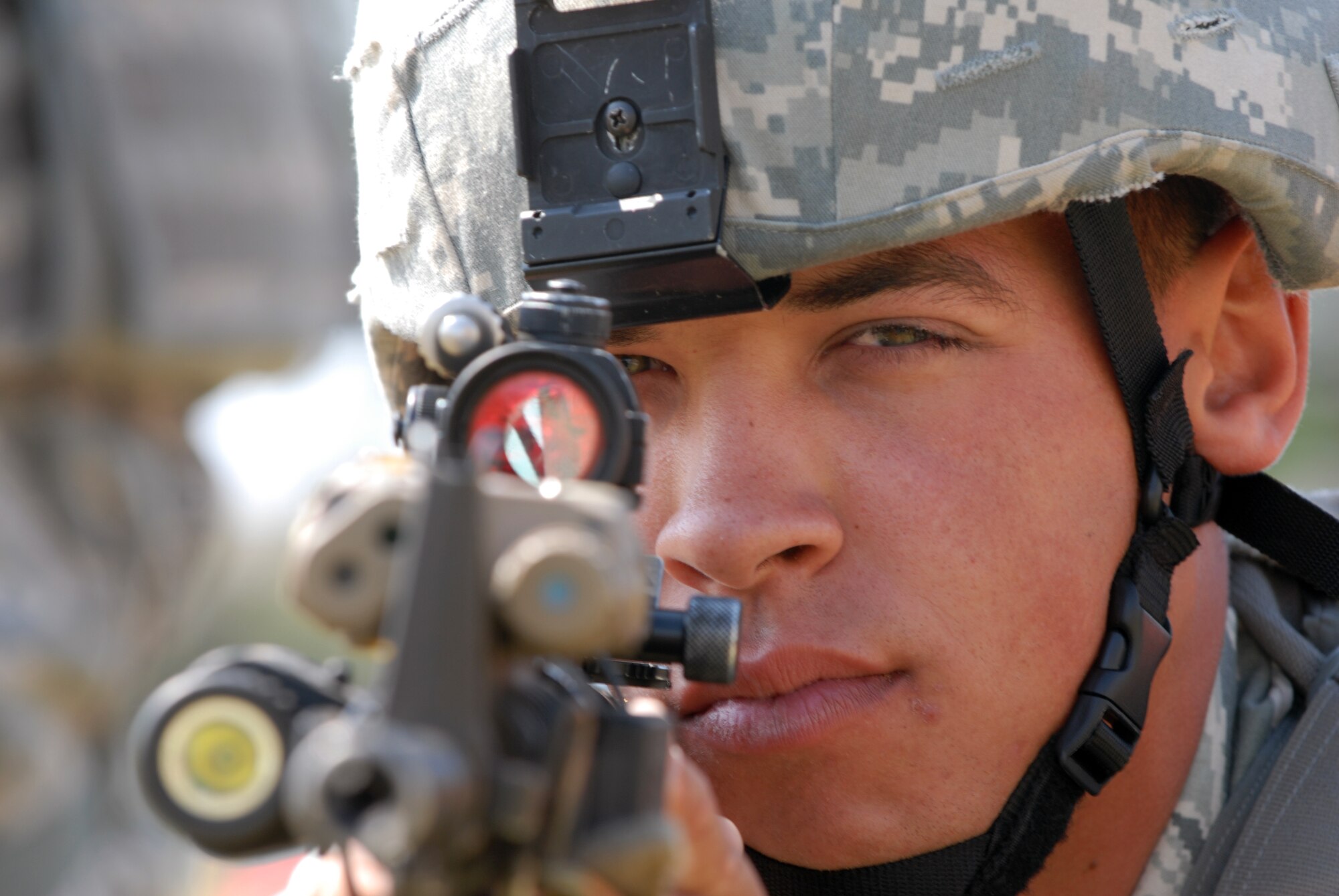 Senior Airman Mike Ray, 8th Security Force Squadron Assassins flight, keeps watch while a team member programs a radio during the Defenders Challenge Sept. 28, 2012, at Kunsan Air Base, Republic of Korea. Throughout the competition, teams were expected to display proper team movements. (U.S. Air Force photo/Senior Airman Brigitte N. Brantley)