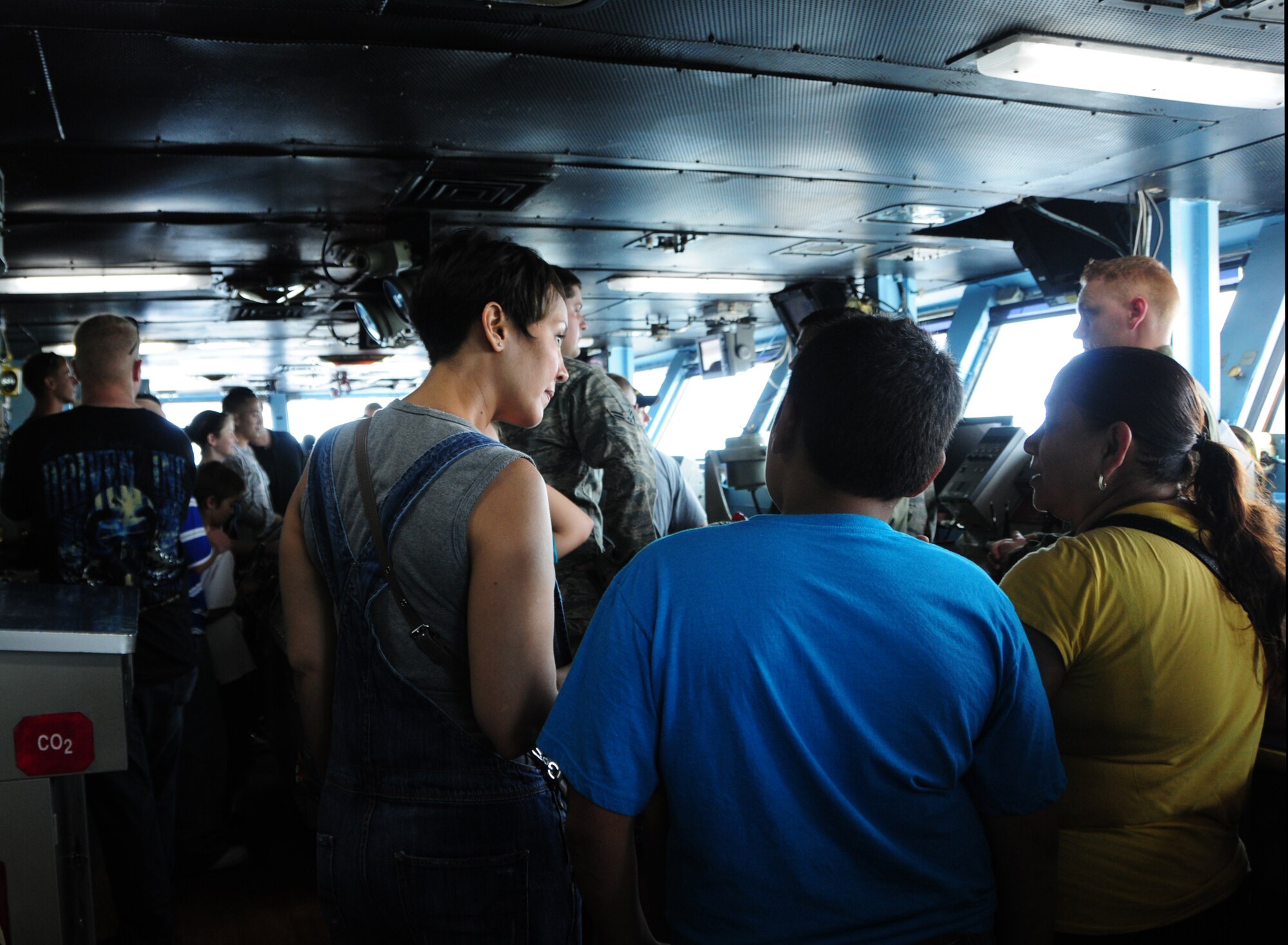 NAVAL BASE, Guam – Andersen Air Force Base Airmen and their Families explore the USS George Washington (CVN 73) during a tour of the carrier here, Sept. 22. Airmen and their families were able to see Naval aircraft up close while crewmembers provided the tour groups with information on the aircraft and the carrier’s historical background. (U.S. Air Force photo by Airman 1st Class Marianique Santos/Released)