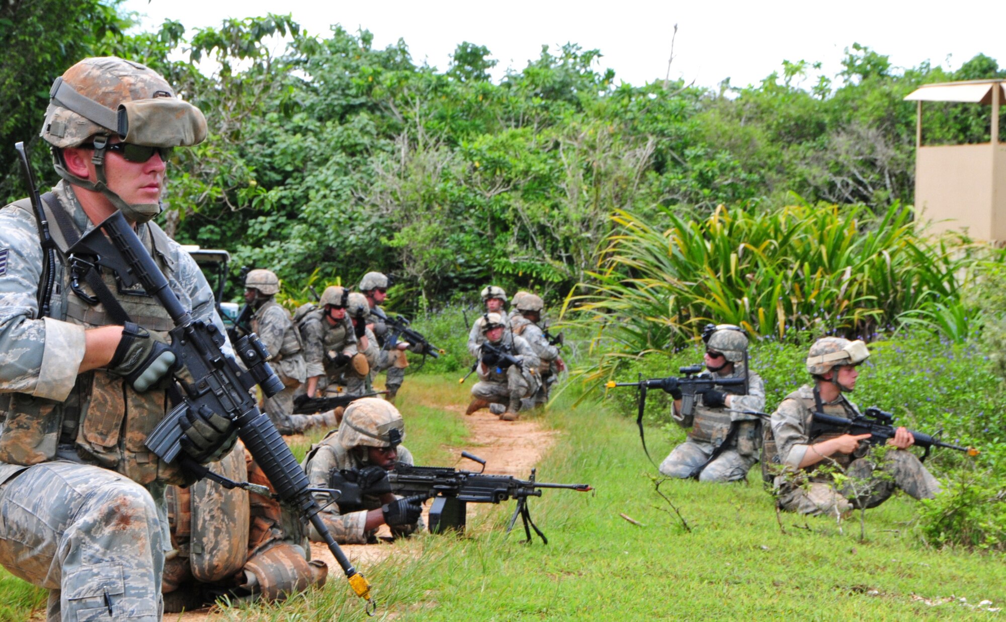 PACIFIC REGIONAL TRAINING CENTER, Guam – A Commando Warrior fire team stays low and vigilant after being fired at during a patrol scenario here, Sept. 24. Security forces Airmen from all over the Pacific travel to Guam in order to receive mandatory contingency training from the 736th Security Forces Squadron Commando Warrior flight in preparation for future deployments downrange. (U.S. Air Force photo by Airman 1st Class Marianique Santos/Released)