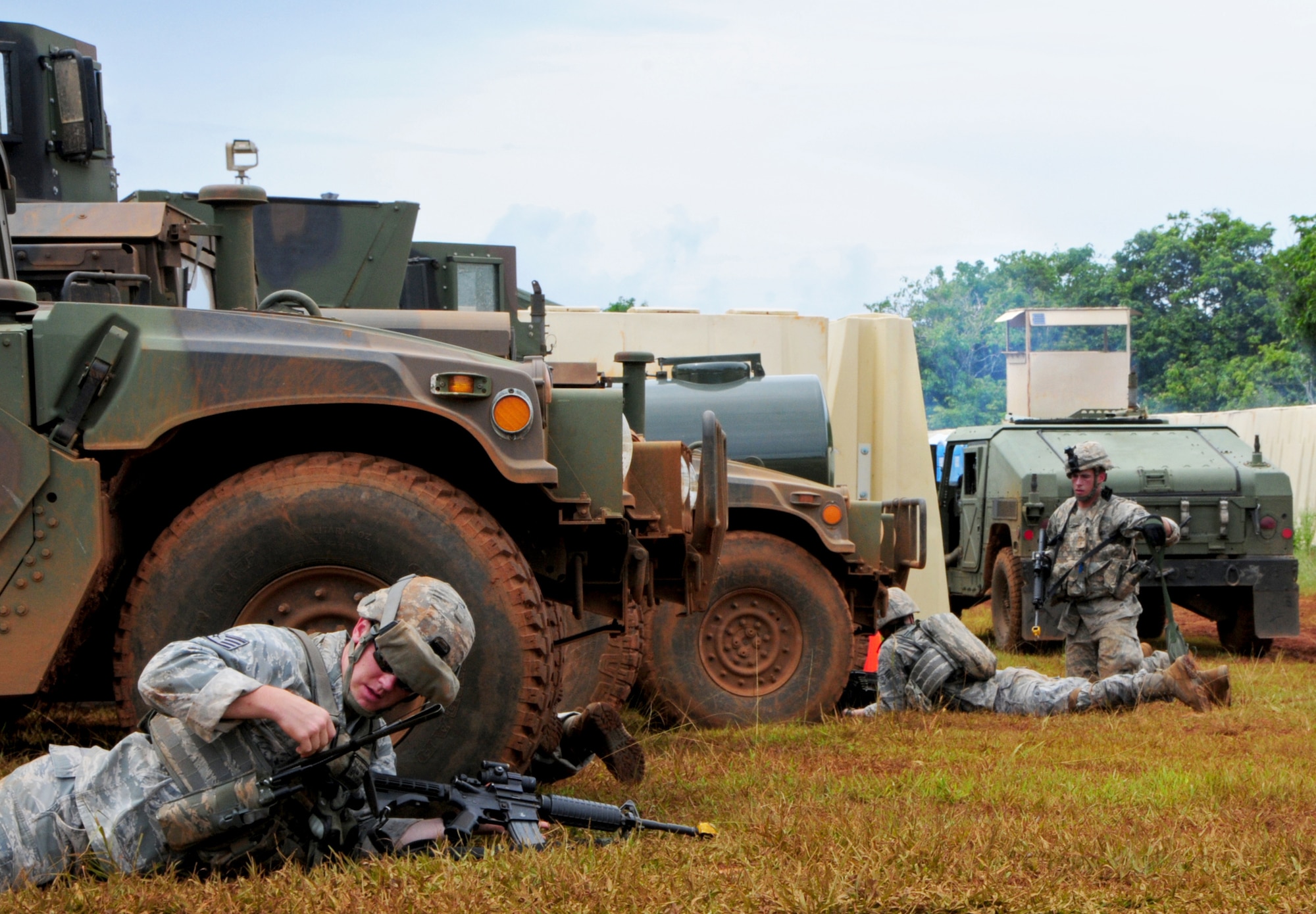 PACIFIC REGIONAL TRAINING CENTER, Guam – Commando Warrior students take cover after hearing multiple simulated mortar attacks during contingency training here, Sept. 24. Security forces Airmen from all over the Pacific travel to Guam in order to receive mandatory contingency training from the 736th Security Forces Squadron Commando Warrior flight in preparation for future deployments downrange. (U.S. Air Force photo by Airman 1st Class Marianique Santos/Released)