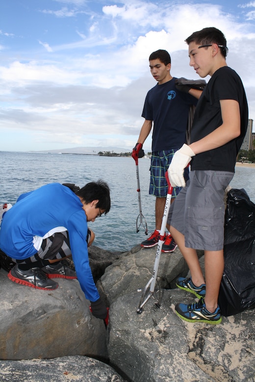 Cadets from the Punahou JROTC Program clean up Fort DeRussy as part of National Public Lands Day.  “We’ve got about 22 students out here today all engaged in a great effort to help the environment. We’re really pleased with what they do,” said Lt. Col. Robert Takao, JROTC commander at Punahou High School. His cadets concentrated their efforts on cleaning up the beach berm behind historic Battery Randolph. “We’ve been doing this for the last five or six years and we always get willing volunteers. It’s never hard to get the cadets to come out because they realize how good it is for our world to do things like this. I’m really proud of them,” Takao said. 