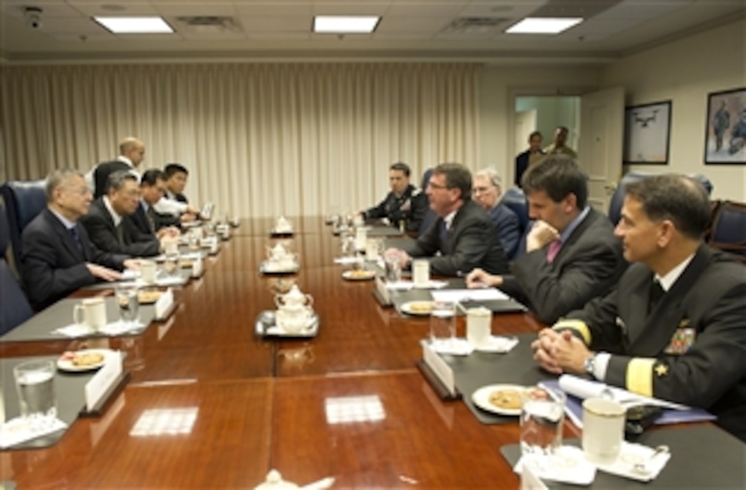 Deputy Secretary of Defense Ashton Carter, second from right, meets with Taiwan's Vice Minister of Defense Andrew Yang, left, in the Pentagon on Oct. 2, 2012.  