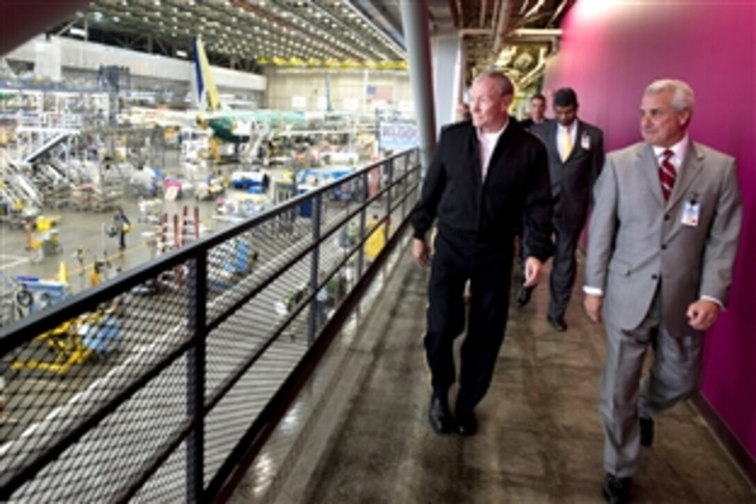Army Gen. Martin E. Dempsey, left, chairman of the Joint Chiefs of Staff, receives a tour of Boeing's 737 plant in Renton, Wash., Oct. 2, 2012. 