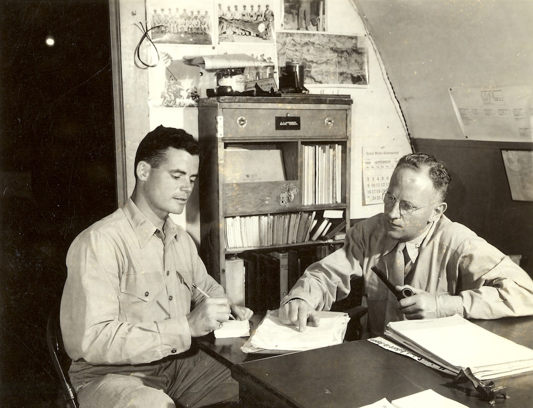 Lt. Dockery is seated to left and Lieutenant Colonel Gooderham L. McCormick (U.S.M.C.R.) to the right. LtCol. McCormick was the D-2 of the 4th Marine Division