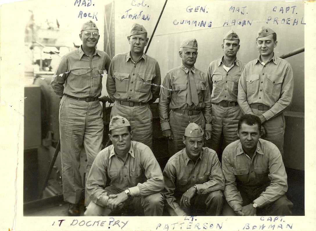 Top row left to right: Major Rock, Colonel Walter I. Jordan (D-1 for Headquarters 4th Marine Division), Brigadier General S.C. Cumming (Assistant Division CO 4th Marine Div.), Major Hagan, Captain Carl W. Proehl. Bottom row left to right: Lieutenant James T. Dockery, Lieutenant Patterson, Captain Bowman