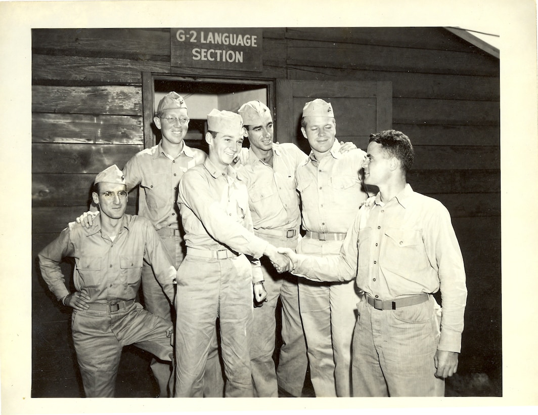 "Dan Jim left. Saying goodbye to bunch of Jap Interpeters Intelligence Division."
