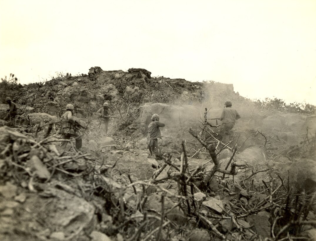 Marines attacking a Japanese position.