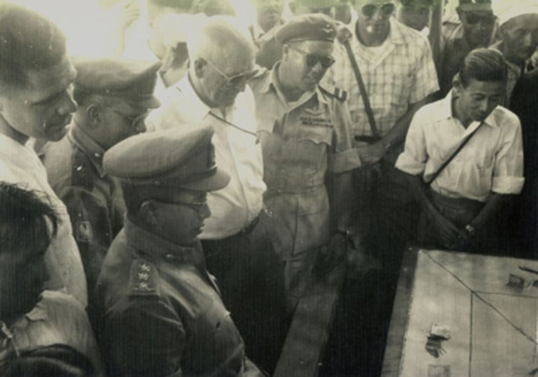 Assistant to the Secretary of Defense Erskine on an official visit to Thailand.


