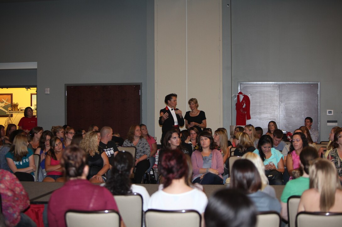 Sgt. Maj. Angela M. Maness, the station sergeant major of Marine Corps Air Station Cherry Point, addresses a question by a spouses in attendance of the 4th Annual Operation Ball Gown event at Miller's Landing Sept. 28. 