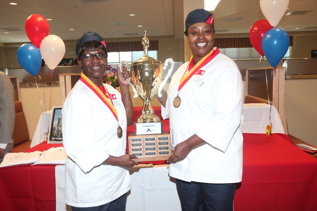 Stacey Brannon and Gloria R. Crawford, cooks with Mess Hall 455, take first place during the Culinary Team of the Quarter cooking competition hosted at the Wallace Creek Mess Hall aboard Marine Corps Base Camp Lejeune Sept. 11. The event was the third Culinary Team of the Quarter event.