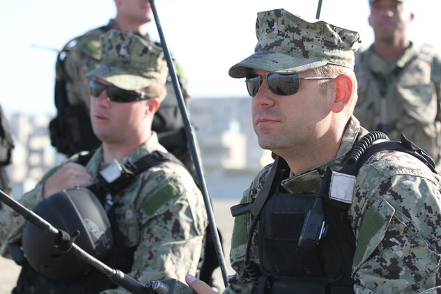 Petty Officer 2nd Class Pendleton Johnson, an information technician serving with Beach Master Unit 1, monitors Ocean Beach before a Landing Craft Air Cushion lands ashore for a disaster relief demonstration during San Francisco Fleet Week Oct. 3. Fleet Week is dedicated to showing civilians the United States military's capability of humanitarian assistance and disaster response preparedness on the home front.