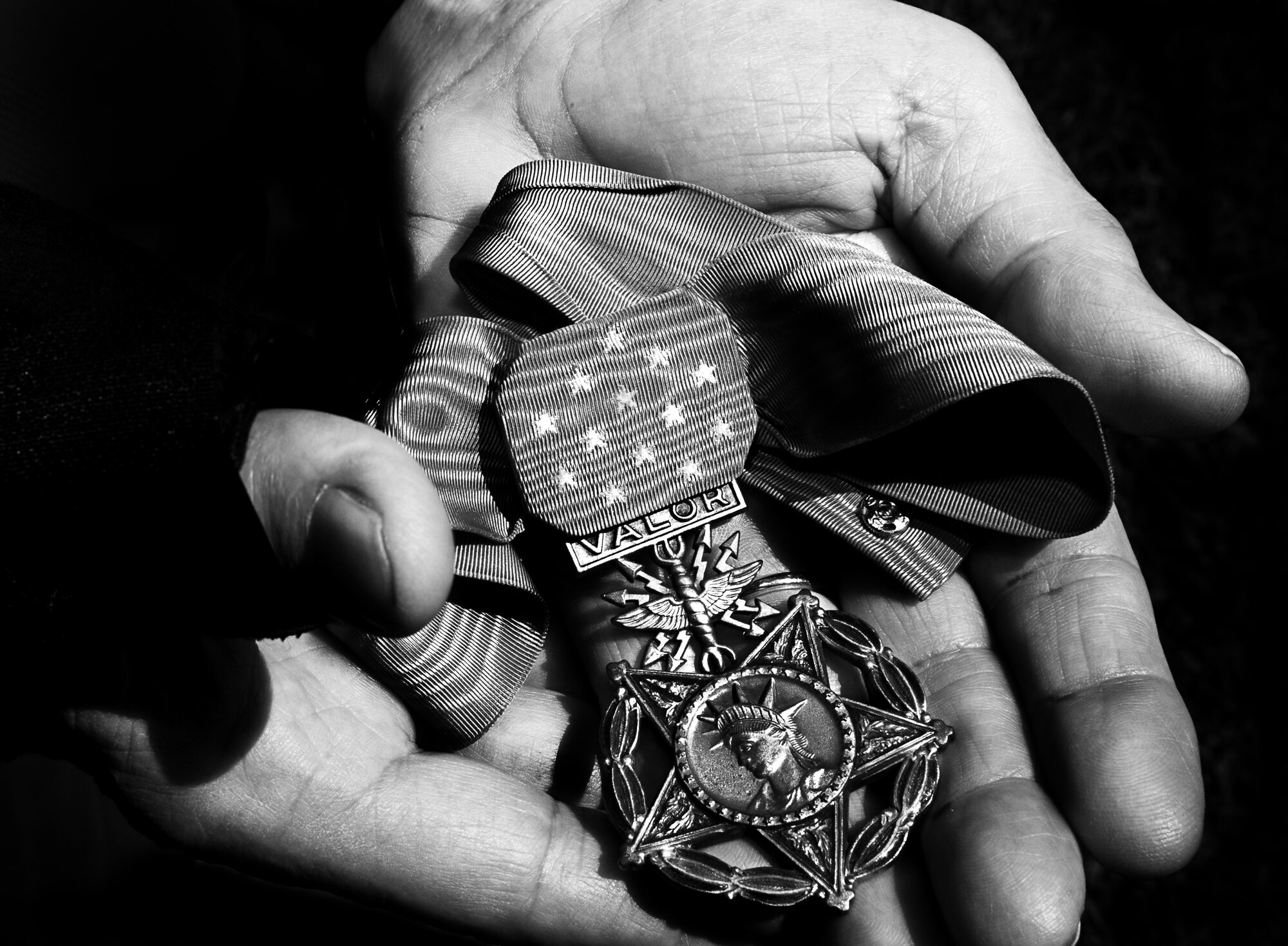 Col. (Ret.) Leo Thorsness, U.S. Air Force veteran of the Vietnam War and Medal of Honor recipient, proudly holds his Medal of Honor during a visit to Joint Base Pearl Harbor-Hickam, Hawaii, Oct. 4. Thorsness was an F-105 pilot in 1967, and on his ninety-third mission in the country he was shot down over North Vietnam. He bailed from his aircraft and was captured by enemy forces and spent six years as a Prisoner of War in Hanoi, Vietnam. (U.S. Air Force photo/Senior Airman Lauren Main)