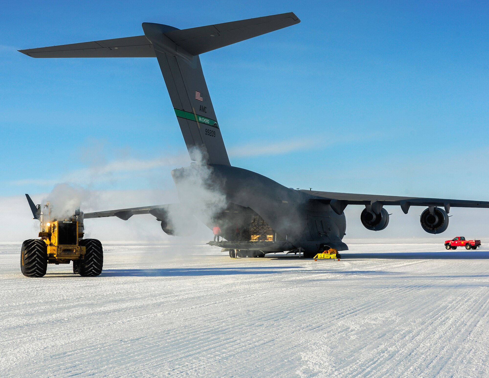A C-17 Globemaster III aircraft from Joint Base Lewis-McChord, Wash., is off-loaded by a forklift, Oct. 1, 2012, at McMurdo Station, Antarctica. The plane delivered 64,000 pounds of cargo and 76 passengers to the research station in its first Operation Deep Freeze mission of the 2012-2013 main season. (U.S. Air Force photo/Staff Sgt. Sean Tobin)