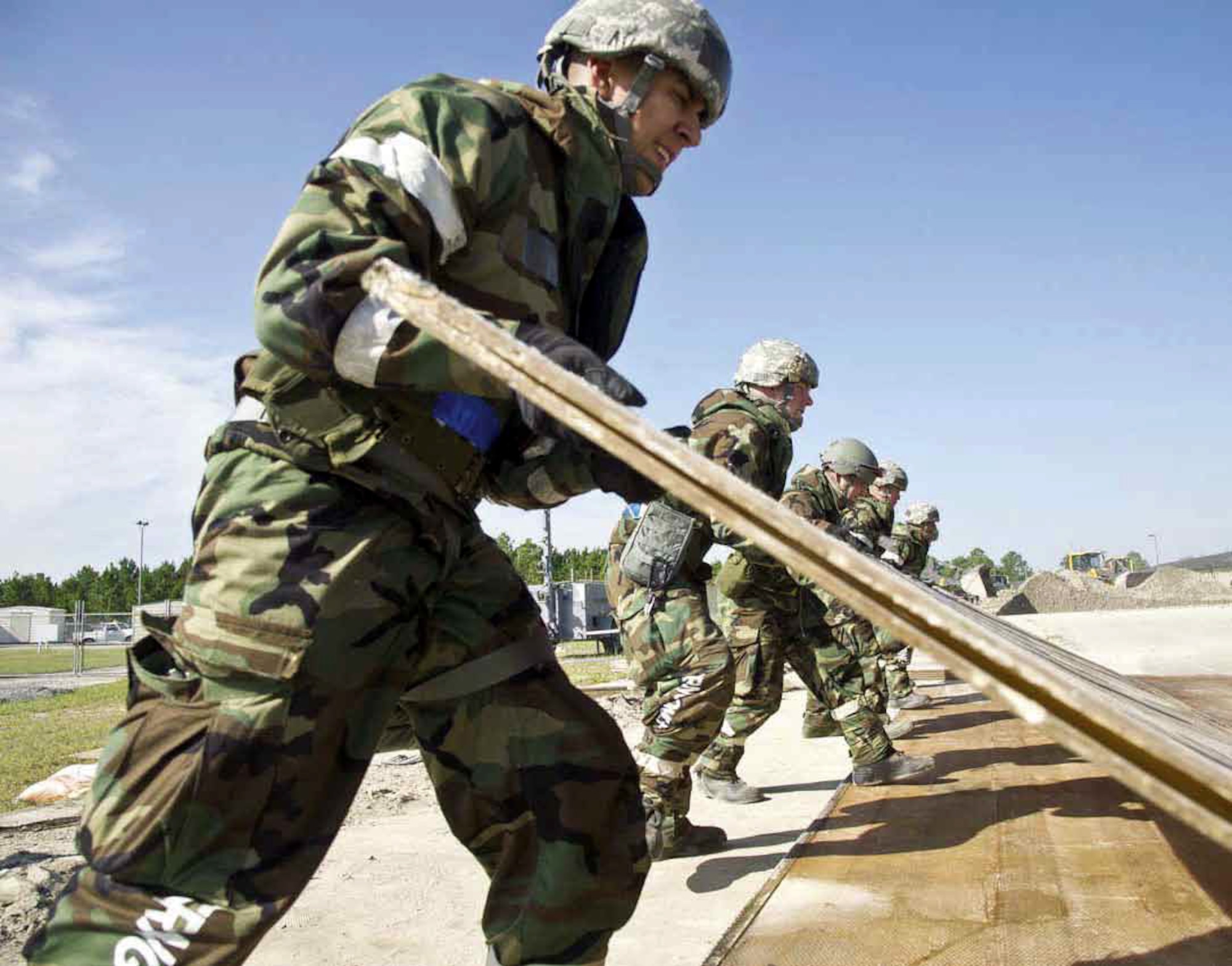 Members participating in the Operational Readiness Exercise, Crisis Challenge
09-12B, at the Combat Readiness Center in Gulfport, Miss., Sept. 17, 2012, use
teamwork to assemble a barrier the will be used for shelter during the exercise.
 (U.S. Air Force photo by Tech. Sgt. Efren Lopez)
