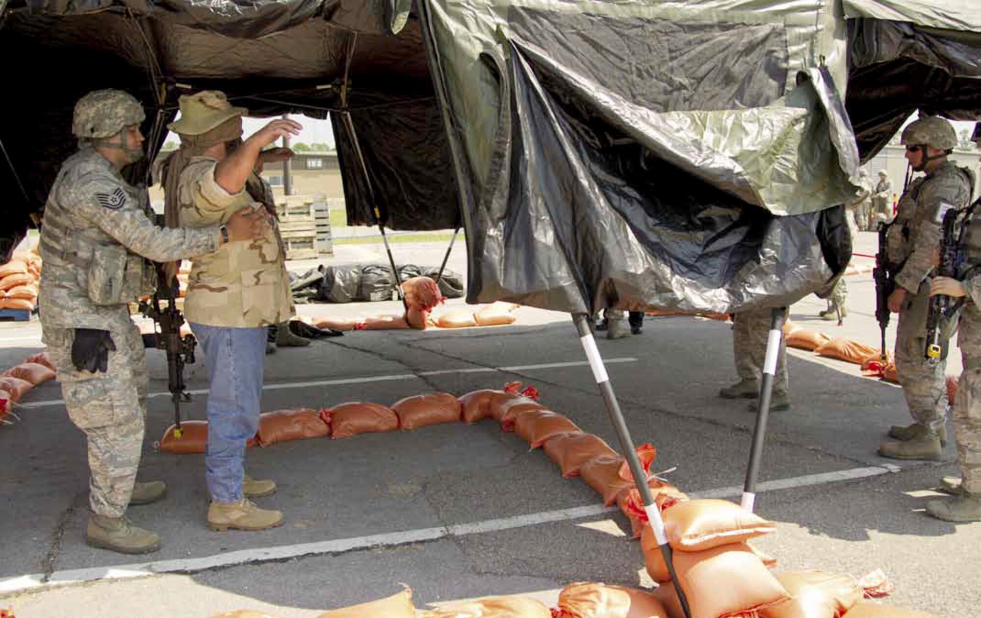 U.S. Air Force Tech. Sgt. Gabriel Lleras from the 452nd Security Forces Squadron,
March Air Reserve Base, Calif., searches a host national for unauthorized
material at an entry control point, during Operational Readiness Exercise, Crisis
Challenge 09-12B, at the Combat Readiness Center in Gulfport, Miss., Sept. 19,
2012. (U.S. Air Force photo by Tech. Sgt. Efren Lopez)
