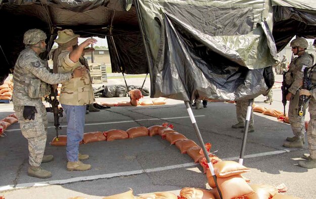 U.S. Air Force Tech. Sgt. Gabriel Lleras from the 452nd Security Forces Squadron,
March Air Reserve Base, Calif., searches a host national for unauthorized
material at an entry control point, during Operational Readiness Exercise, Crisis
Challenge 09-12B, at the Combat Readiness Center in Gulfport, Miss., Sept. 19,
2012. (U.S. Air Force photo by Tech. Sgt. Efren Lopez)
