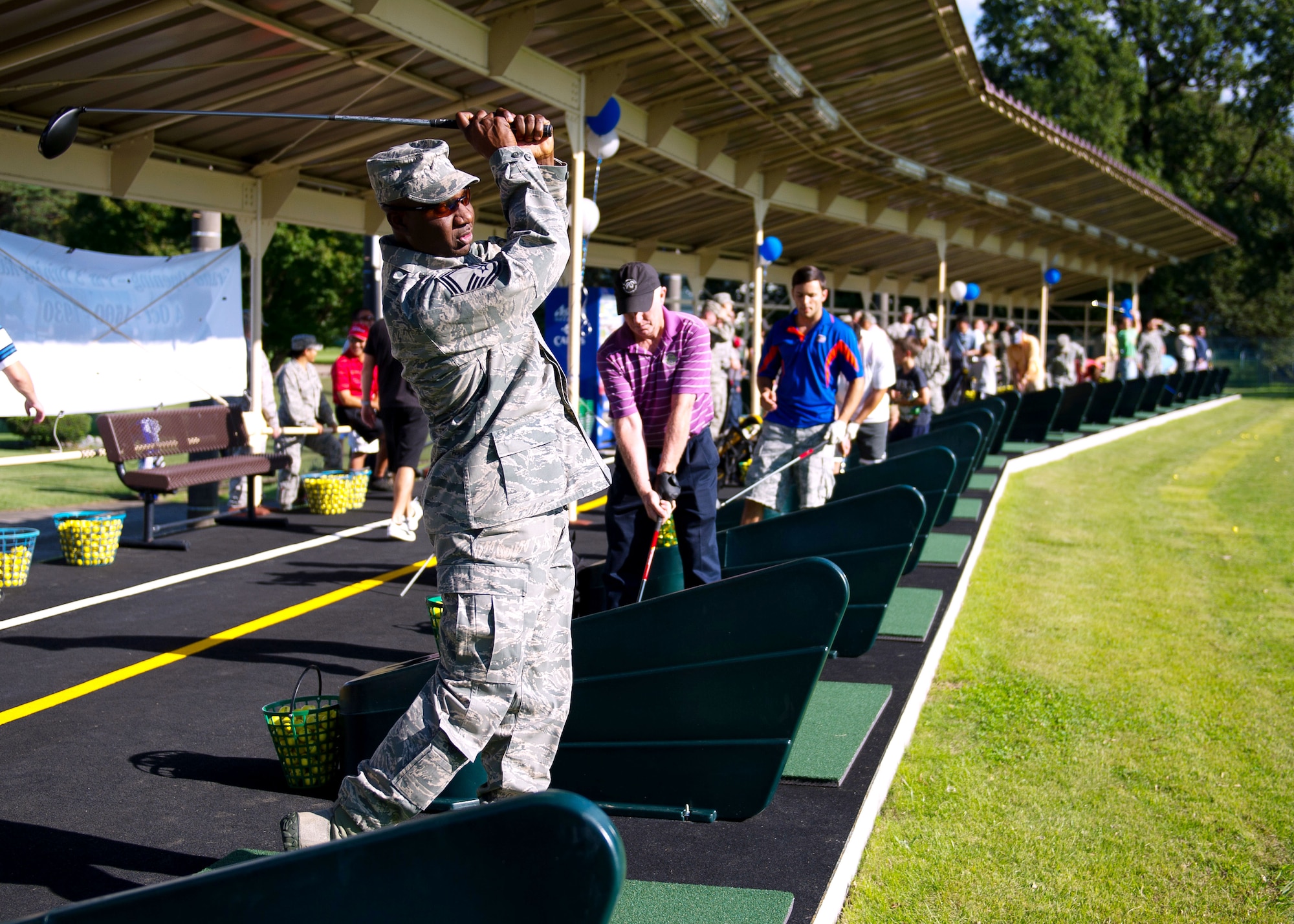 YOKOTA AIR BASE, Japan – Senior Master Sgt. Quardrick Brumfield, 374th Force Support Squadron Samurai Café section chief, hits golf balls after the grand opening of the Yokota driving range, Yokota Air Base, Japan, on Oct. 4, 2012. The new range was in planning for more than three years and cost $2.6 million. (U.S. Air Force photo by Staff Sgt. Chad C. Strohmeyer)