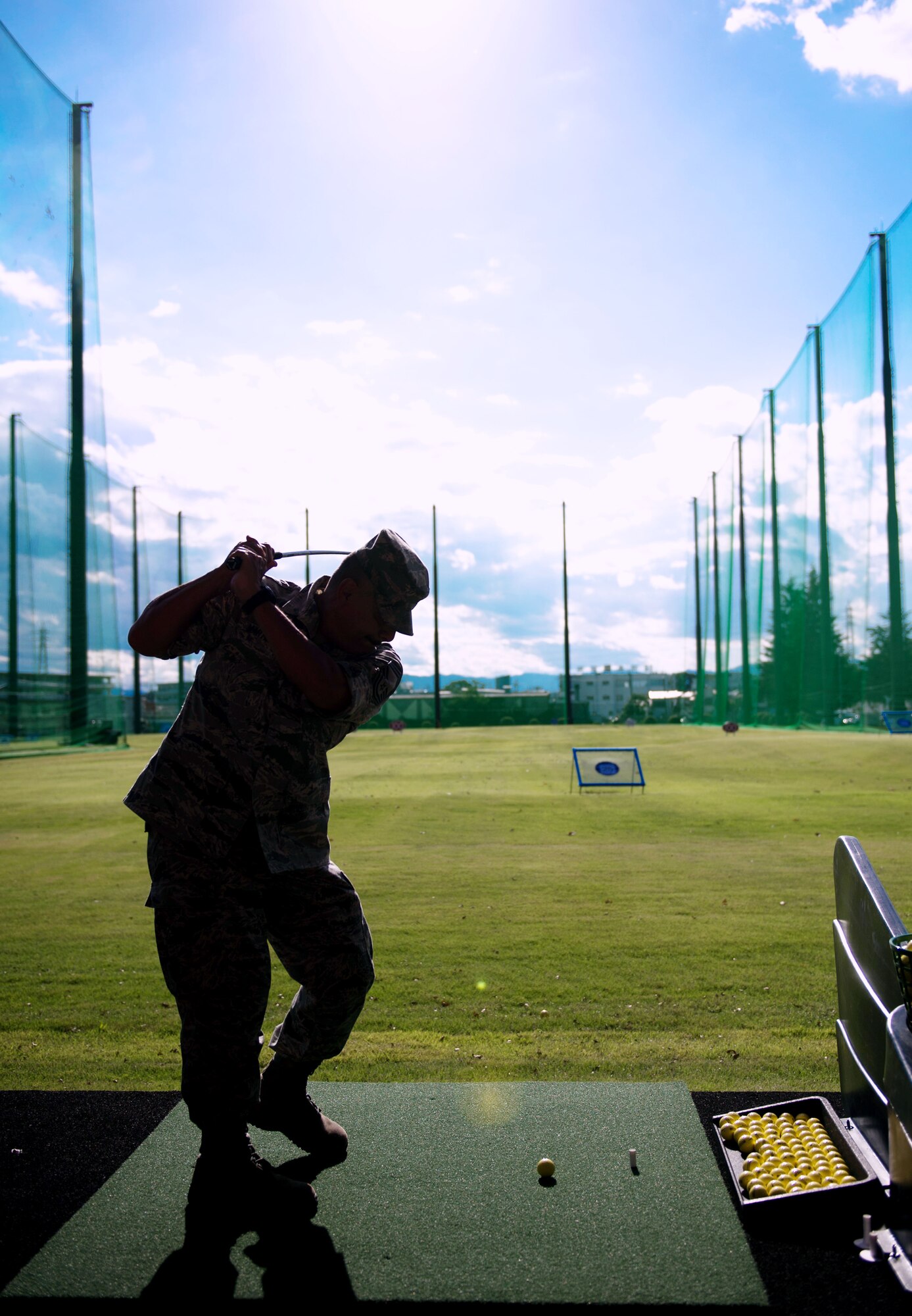 YOKOTA AIR BASE, Japan – Chief Master Sgt. Rojelio Martinez, 374th Medical Group superintendent, hits golf balls after the grand opening of the Yokota driving range, Yokota Air Base, Japan, on Oct. 4, 2012. The new range allows for 28 golfers to play at the same time. (U.S. Air Force photo by Staff Sgt. Chad C. Strohmeyer)