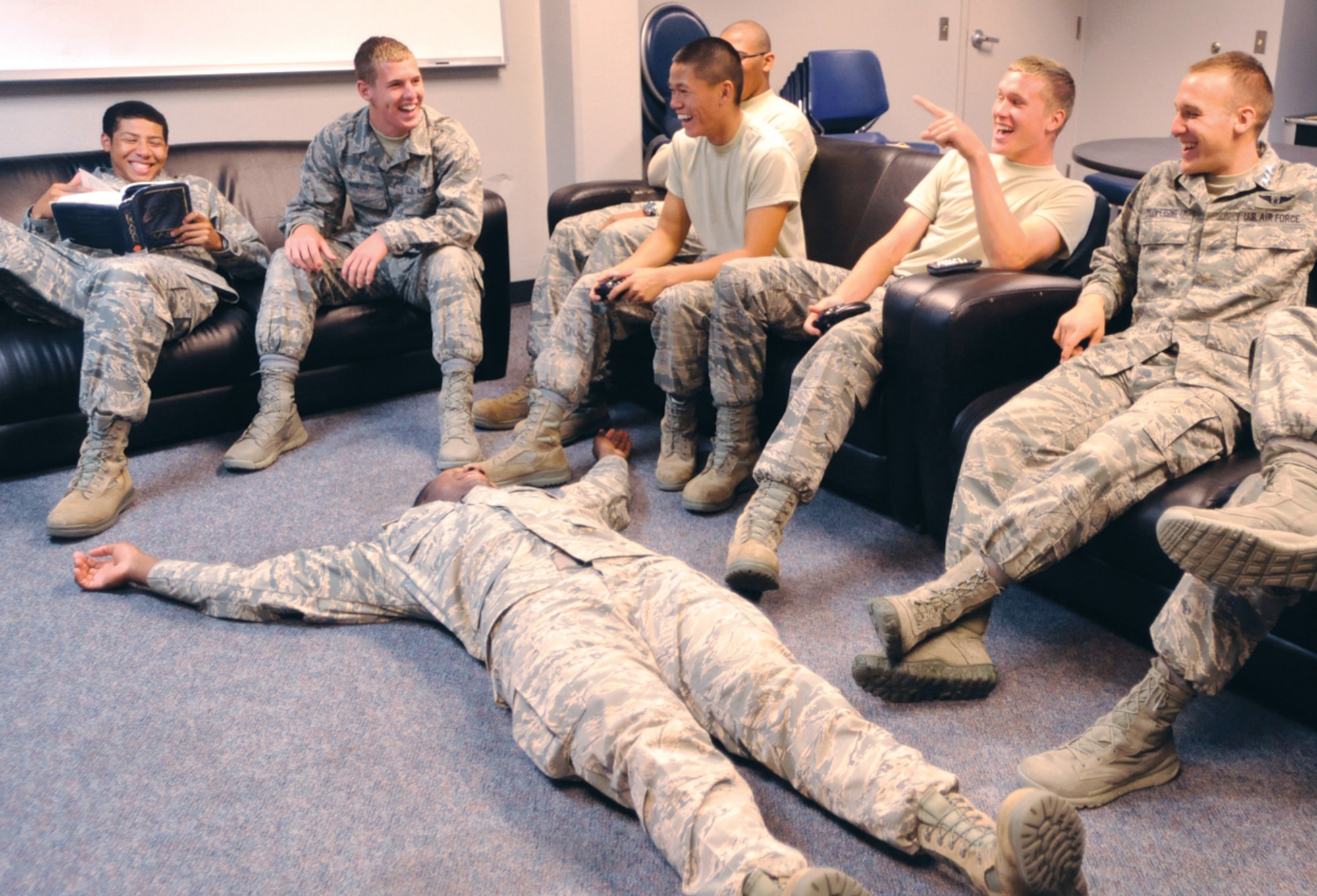 Cadet Candidate William Roe, second from left, jokes with fellow Air Force Academy Preparatory School students between classes Oct. 3, 2012. Roe, a native of Robinson, Texas, said they watch sports or play video games when not studying. (U.S. Air Force photo/Carol Lawrence)